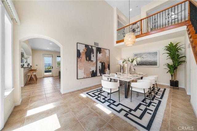 23735 Canyon Vista Ct, Diamond Bar, CA 91765 - dining area with a towering ceiling, tile patterned floors, arched walkways, and recessed lighting