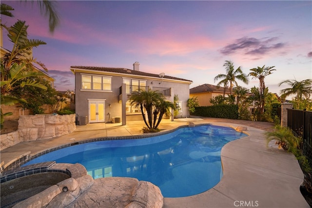 23735 Canyon Vista Ct, Diamond Bar, CA 91765 - pool at dusk featuring a patio and a pool with connected hot tub