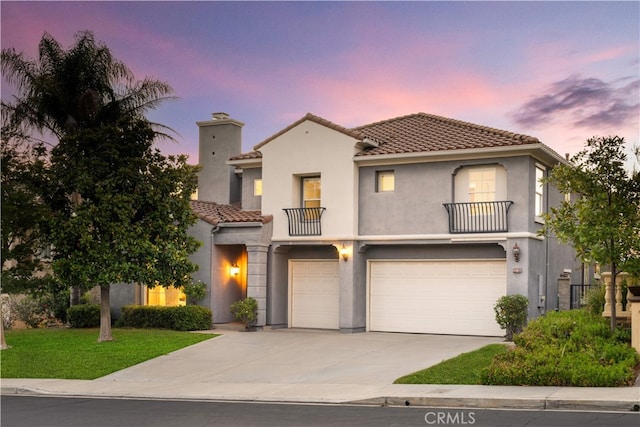 23735 Canyon Vista Ct, Diamond Bar, CA 91765 - mediterranean / spanish-style house featuring a tile roof, a balcony, an attached garage, driveway, and stucco siding
