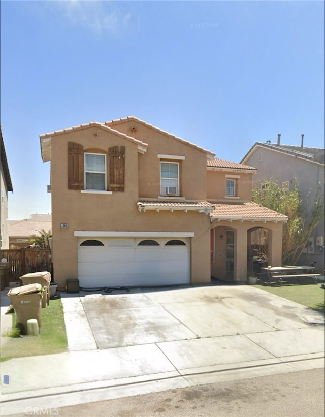 8743 Redondo Ave, Hesperia, CA 92344 - mediterranean / spanish-style house with a tiled roof, a garage, stucco siding, and driveway