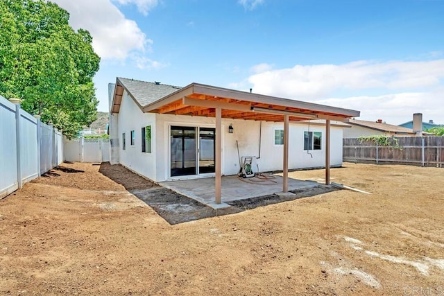 10758 Princess Arlene Dr, Santee, CA 92071 - back of property featuring a patio area, a fenced backyard, and stucco siding
