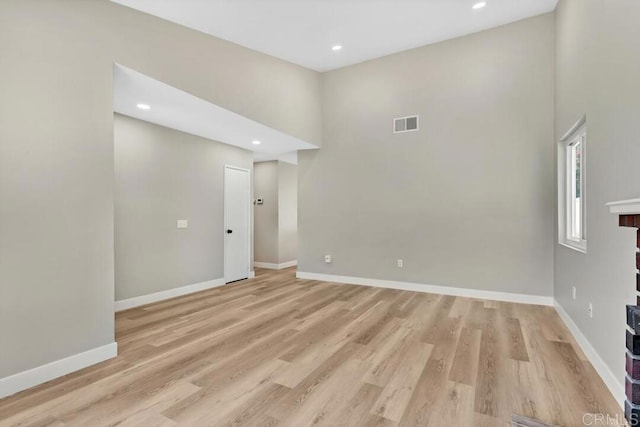10758 Princess Arlene Dr, Santee, CA 92071 - spare room featuring a high ceiling, light wood-style flooring, and recessed lighting