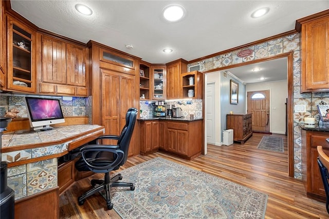 24481 Jutewood Pl, Lake Forest, CA 92630 - office space with built in desk, ornamental molding, light wood finished floors, and recessed lighting