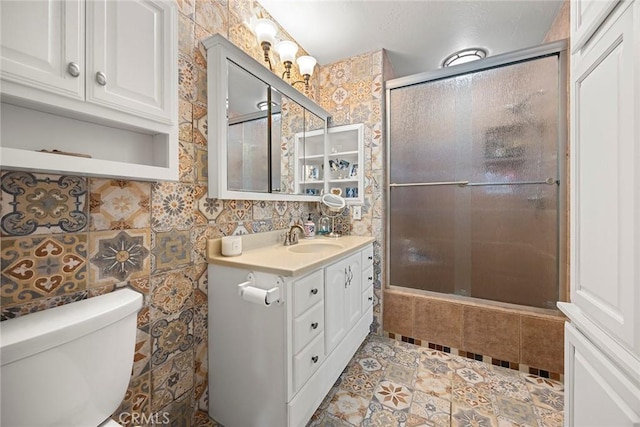 24481 Jutewood Pl, Lake Forest, CA 92630 - bathroom with vanity, a shower with shower door, tile patterned floors, and tile walls