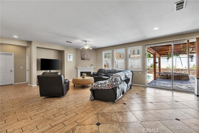 296 Lady Bell Way, Perris, CA 92571 - living area with a ceiling fan, recessed lighting, and a fireplace