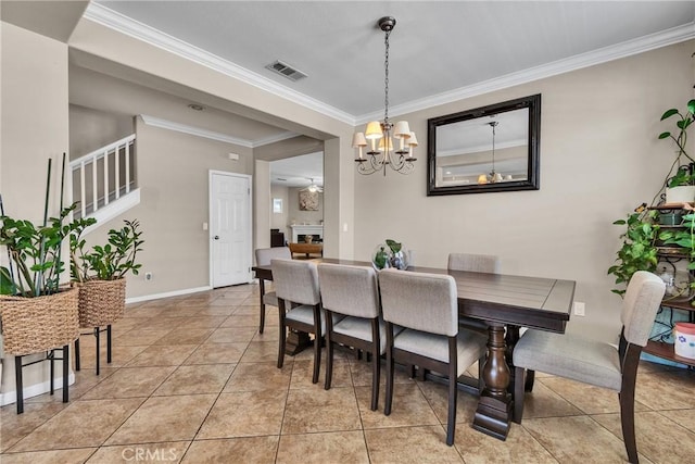 296 Lady Bell Way, Perris, CA 92571 - dining space featuring crown molding, a chandelier, light tile patterned floors, stairs, and a fireplace