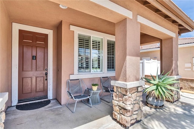 296 Lady Bell Way, Perris, CA 92571 - doorway to property featuring stucco siding and covered porch