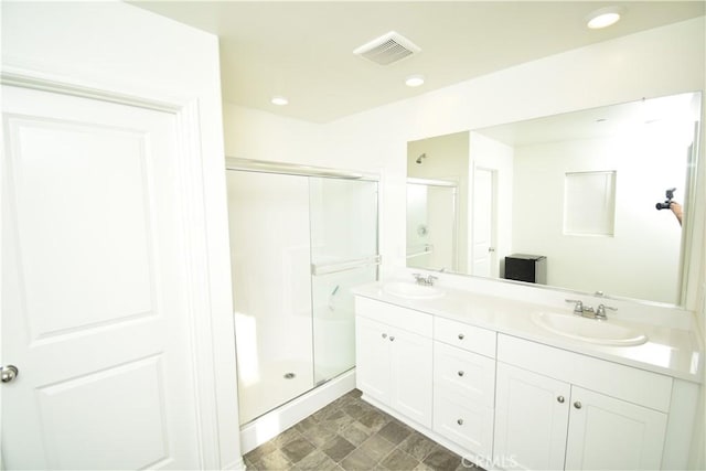 5280 Coyote St, Hemet, CA 92545 - bathroom featuring a shower stall, double vanity, and recessed lighting