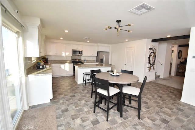 5280 Coyote St, Hemet, CA 92545 - dining space featuring recessed lighting and a chandelier