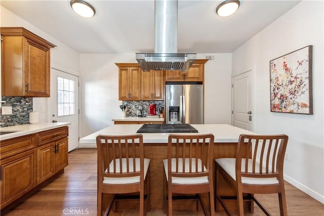 5336 Lemon Grove Ave, Los Angeles, CA 90038 - kitchen featuring brown cabinetry and tasteful backsplash
