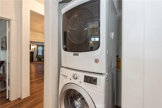 5336 Lemon Grove Ave, Los Angeles, CA 90038 - washroom with stacked washer / drying machine and wood finished floors