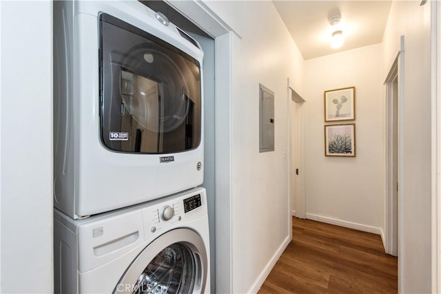 5336 Lemon Grove Ave, Los Angeles, CA 90038 - laundry area featuring stacked washer and clothes dryer, wood finished floors, and electric panel