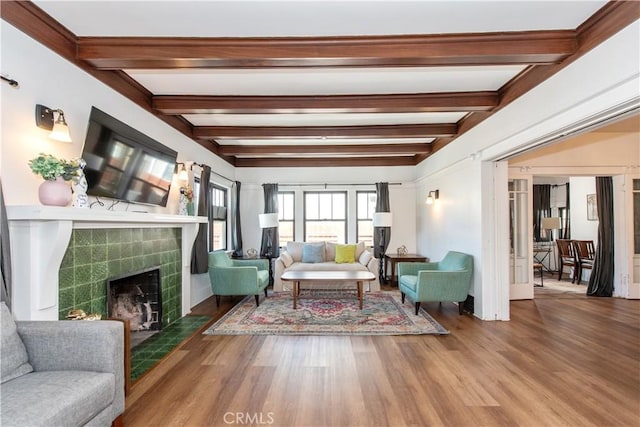 5336 Lemon Grove Ave, Los Angeles, CA 90038 - living room featuring beamed ceiling, wood finished floors, and a fireplace