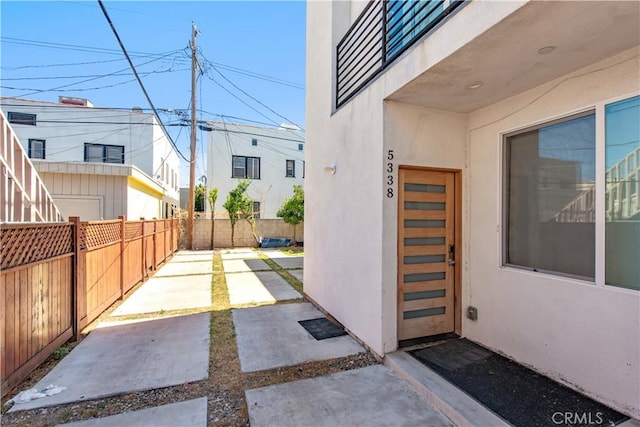 5336 Lemon Grove Ave, Los Angeles, CA 90038 - property entrance with stucco siding and a patio