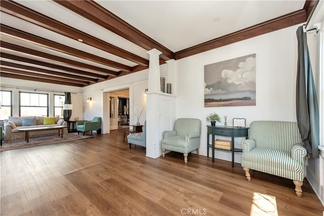 5336 Lemon Grove Ave, Los Angeles, CA 90038 - sitting room with ornate columns, beamed ceiling, and wood finished floors
