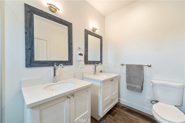 5336 Lemon Grove Ave, Los Angeles, CA 90038 - bathroom featuring two vanities and wood finished floors