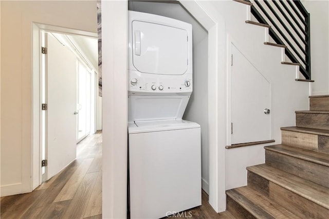 5336 Lemon Grove Ave, Los Angeles, CA 90038 - washroom featuring estacked washer and dryer and wood finished floors