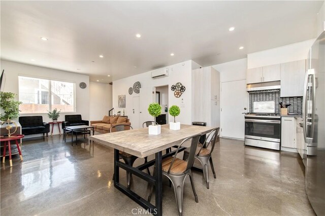 5336 Lemon Grove Ave, Los Angeles, CA 90038 - dining area with recessed lighting, finished concrete flooring, and a wall unit AC