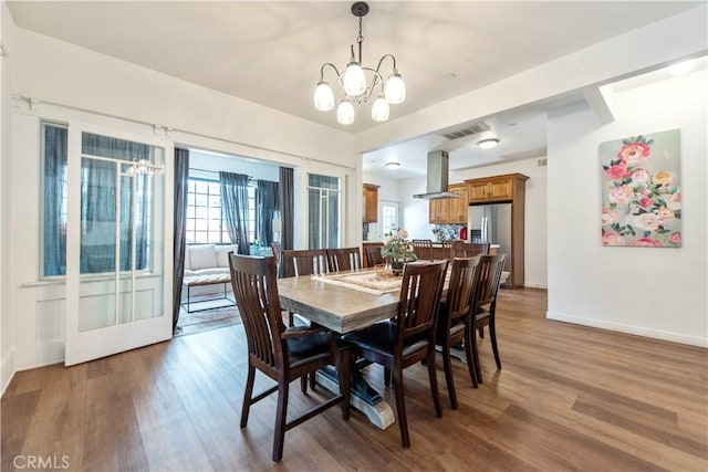 5336 Lemon Grove Ave, Los Angeles, CA 90038 - dining space with a chandelier and wood finished floors