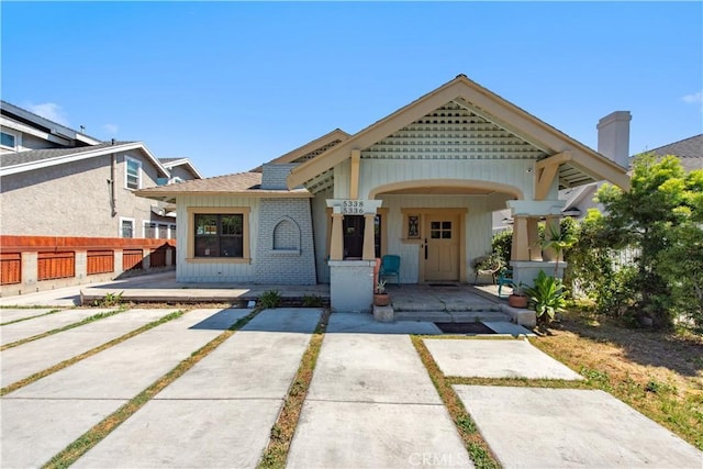 5336 Lemon Grove Ave, Los Angeles, CA 90038 - view of front of home featuring covered porch and a chimney