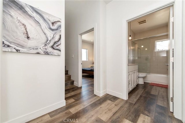 5336 Lemon Grove Ave, Los Angeles, CA 90038 - full bathroom featuring vanity, wood finished floors, and shower / bath combination with glass door