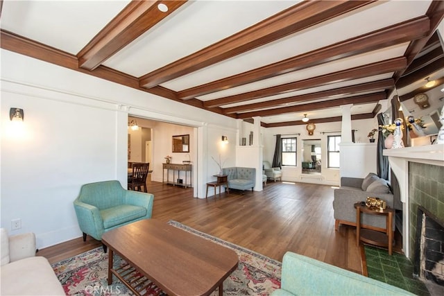 5336 Lemon Grove Ave, Los Angeles, CA 90038 - living area featuring a fireplace, beam ceiling, wood finished floors, and ornate columns