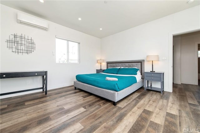 5336 Lemon Grove Ave, Los Angeles, CA 90038 - bedroom with wood finished floors, an AC wall unit, and recessed lighting