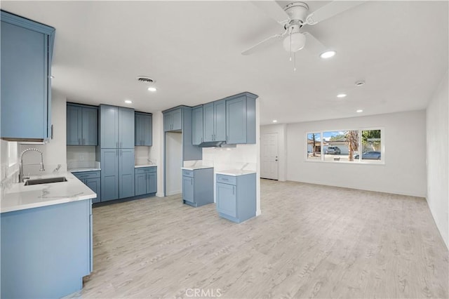 1534 Richfield Ave, Rosamond, CA 93560 - kitchen with light wood finished floors, recessed lighting, and a ceiling fan