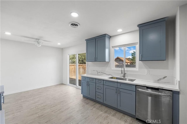 1534 Richfield Ave, Rosamond, CA 93560 - kitchen featuring dishwasher, light wood finished floors, ceiling fan, recessed lighting, and light stone counters