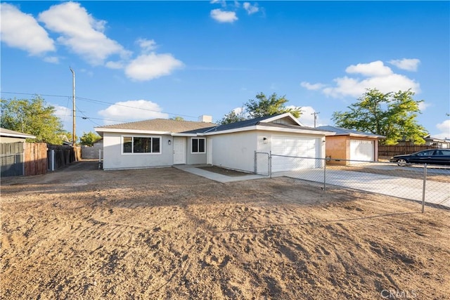 1534 Richfield Ave, Rosamond, CA 93560 - ranch-style home featuring an attached garage, driveway, and stucco siding