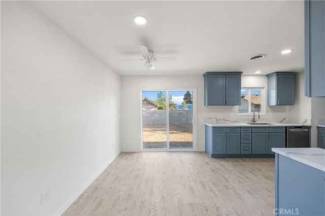 1534 Richfield Ave, Rosamond, CA 93560 - kitchen featuring light countertops, ceiling fan, light wood-style floors, stainless steel dishwasher, and recessed lighting