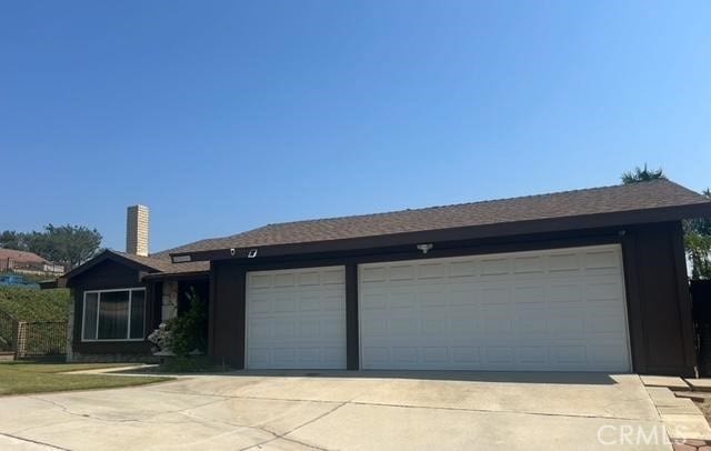 3526 Belle River Dr, Hacienda Heights, CA 91745 - ranch-style home with concrete driveway and a chimney