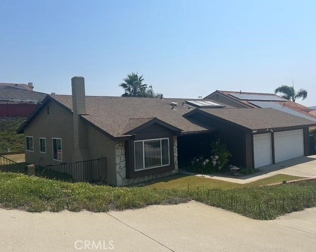 3526 Belle River Dr, Hacienda Heights, CA 91745 - single story home featuring an attached garage, a chimney, concrete driveway, stucco siding, and roof with shingles