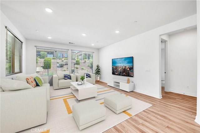 1660 Capri Way, Beaumont, CA 92223 - living area with light wood finished floors and recessed lighting