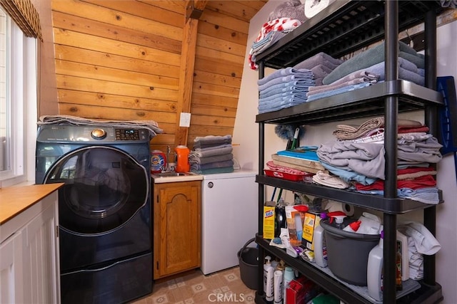 52926 Balsam Dr, Oakhurst, CA 93644 - washroom featuring washer / clothes dryer, cabinet space, and wood walls