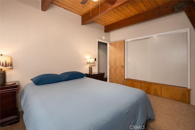 52926 Balsam Dr, Oakhurst, CA 93644 - carpeted bedroom with a wooden ceiling with exposed beams, a closet, and ceiling fan