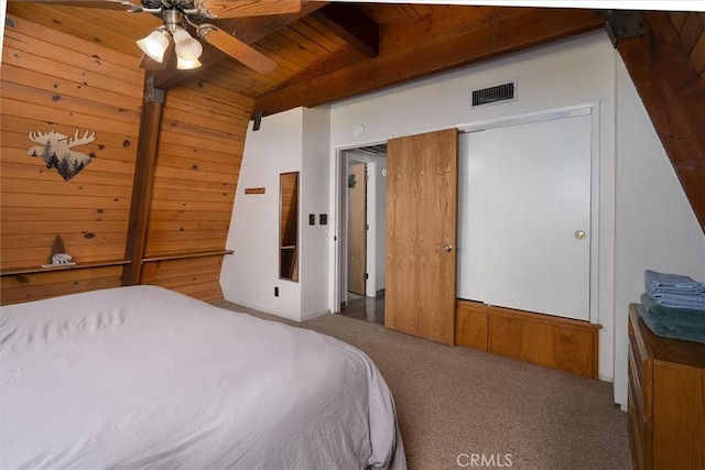 52926 Balsam Dr, Oakhurst, CA 93644 - carpeted bedroom featuring wooden walls, wood ceiling, and ceiling fan