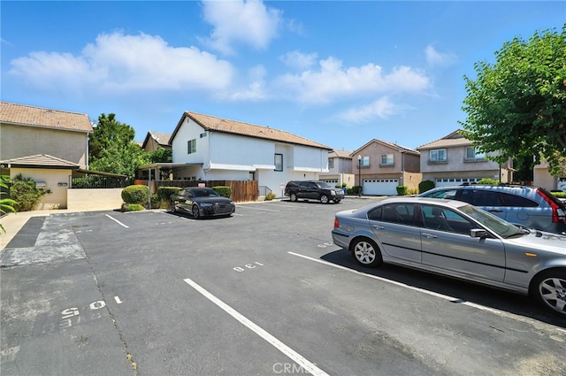 8554 Burnet Ave Unit 144, North Hills, CA 91343 - uncovered parking lot featuring a residential view