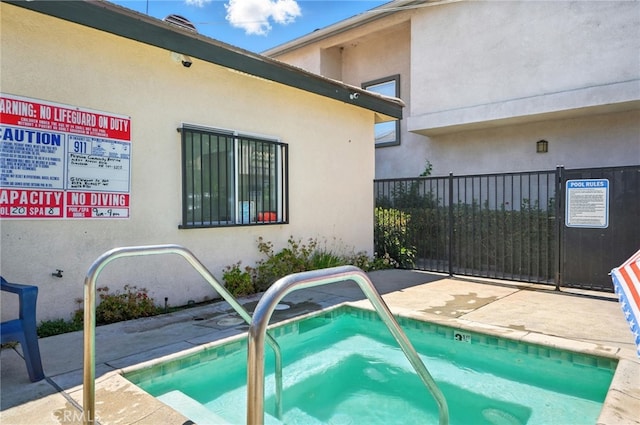 8554 Burnet Ave Unit 144, North Hills, CA 91343 - view of pool with a hot tub