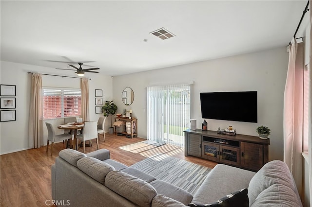8554 Burnet Ave Unit 144, North Hills, CA 91343 - living room with plenty of natural light, wood finished floors, and ceiling fan