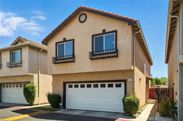 8554 Burnet Ave Unit 144, North Hills, CA 91343 - mediterranean / spanish-style home featuring stucco siding and a garage