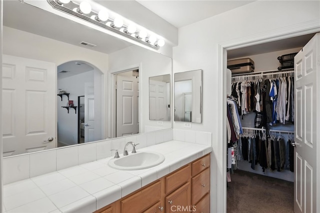 8554 Burnet Ave Unit 144, North Hills, CA 91343 - bathroom with vanity and a spacious closet