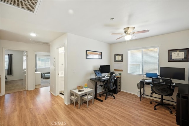 8554 Burnet Ave Unit 144, North Hills, CA 91343 - home office featuring light wood-style flooring and a ceiling fan