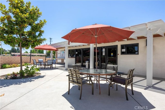 13341 Twin Hls Unit 57C, Seal Beach, CA 90740 - view of patio featuring outdoor dining area and a pergola