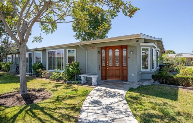 13341 Twin Hls Unit 57C, Seal Beach, CA 90740 - view of front of house with stucco siding and a front yard