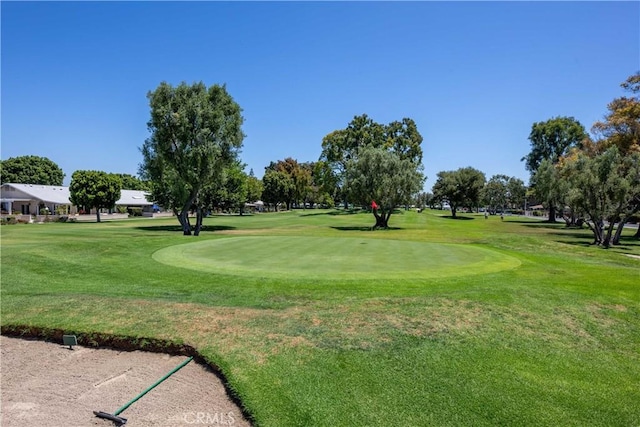 13341 Twin Hls Unit 57C, Seal Beach, CA 90740 - surrounding community with a yard and view of golf course