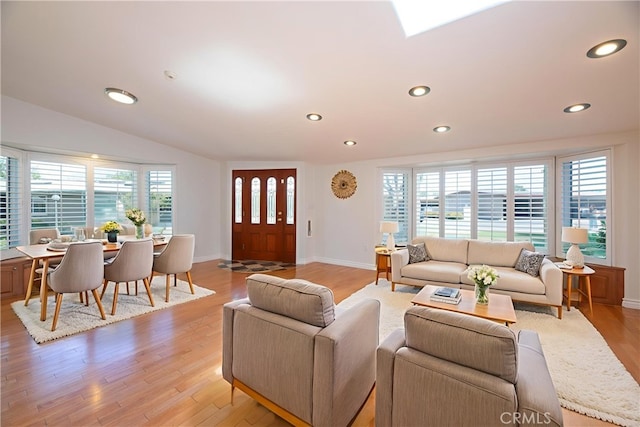 13341 Twin Hls Unit 57C, Seal Beach, CA 90740 - living room with light wood-type flooring, recessed lighting, and lofted ceiling