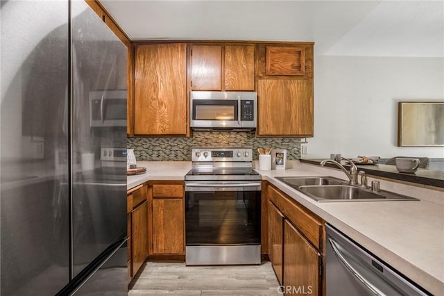 939 W Pine St Unit 44/D, Upland, CA 91786 - kitchen featuring appliances with stainless steel finishes and brown cabinetry