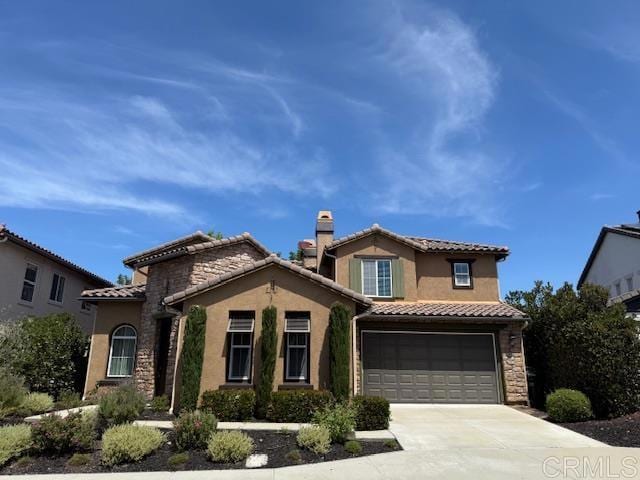 880 Summer Moon Rd, San Marcos, CA 92078 - mediterranean / spanish home featuring driveway, a garage, a tiled roof, and stucco siding