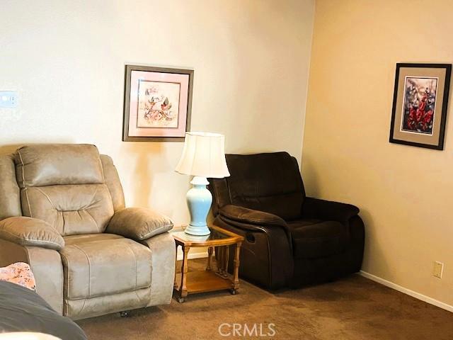 13212 La Jolla Cir Unit 307B, La Mirada, CA 90638 - sitting room with carpet flooring and baseboards